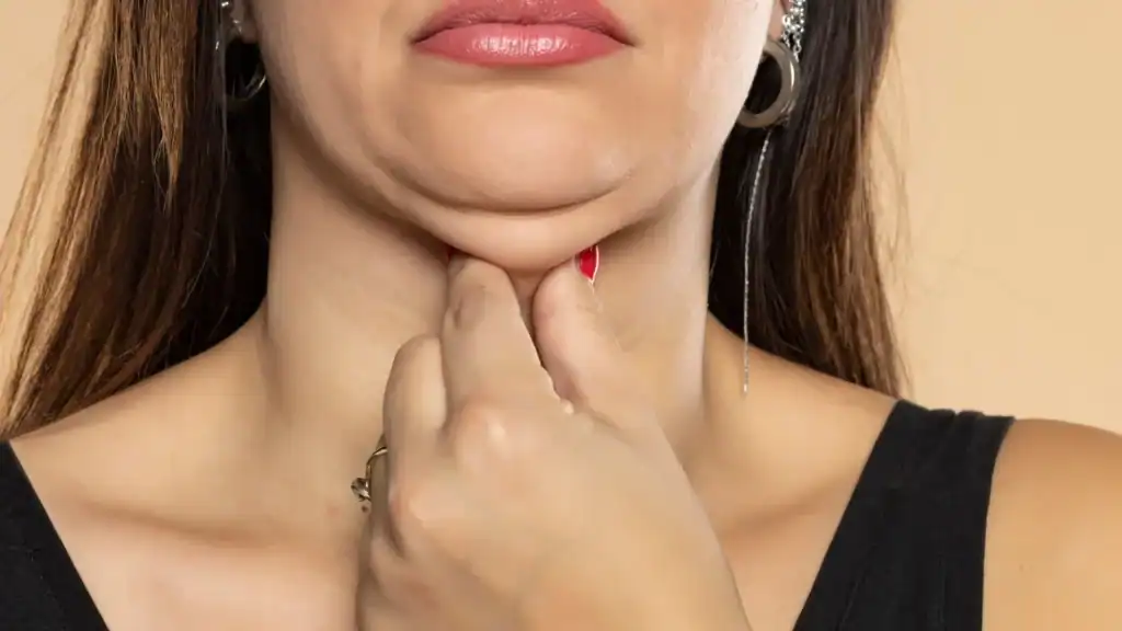 An image of a woman with double chin, sad, worried : Non Surgical Double Chin Removal Treatment in Wentworth, UK