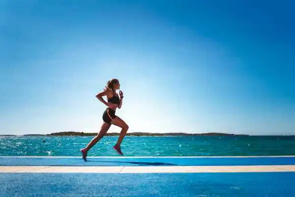 Woman running showing strong leg muscle Wentworth
